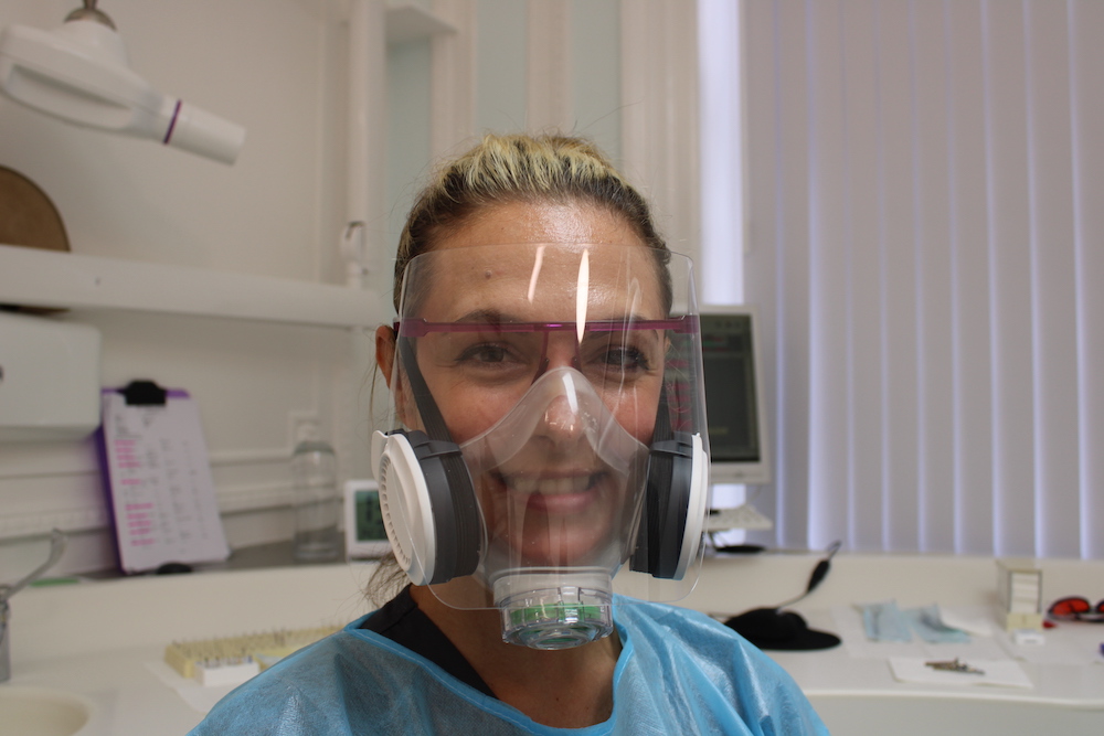 Dental nurse with shield and Helloface mask
